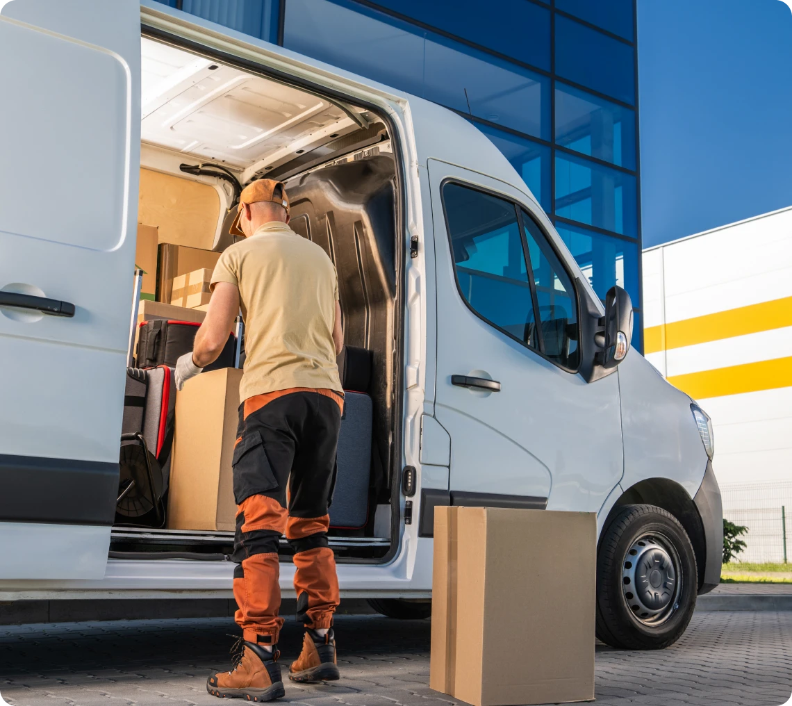 Delivery worker loading a van